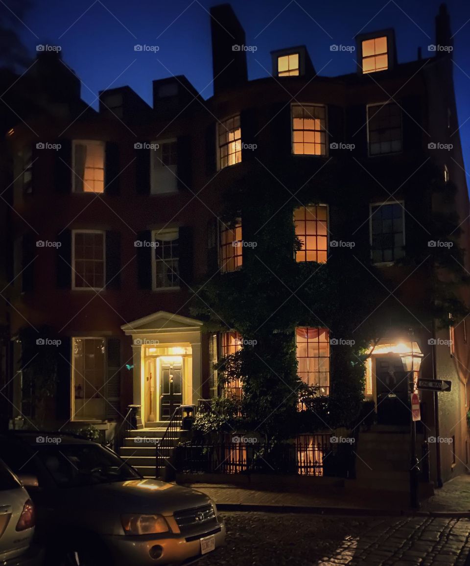 Brownstone on Beacon Hill in Boston all lit up at night 