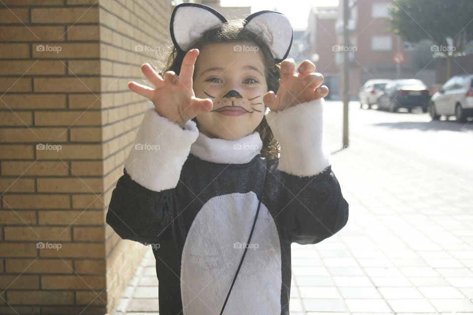 Little girl wearing cat costume