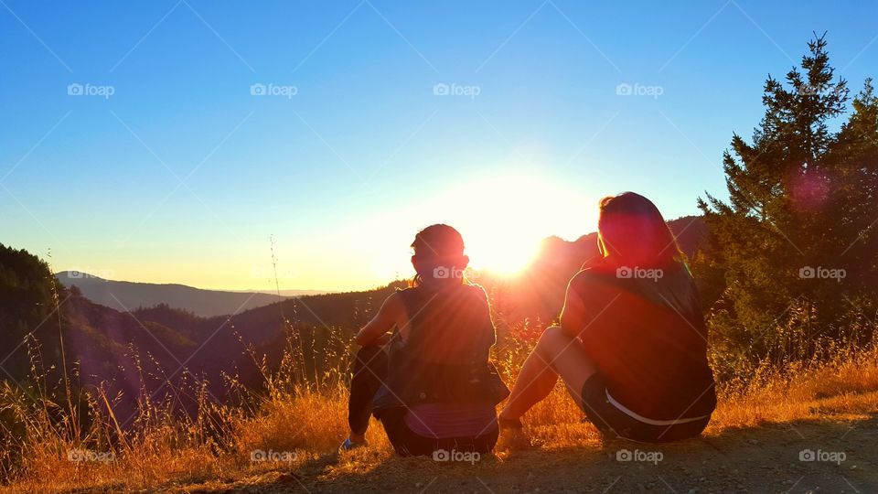 Two hiker looking at sunrise