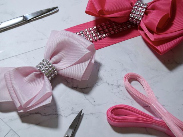 Beautiful pale and hot pink bows, secured with diamanté centres accompanied by silver scissors & pink ribbon.
