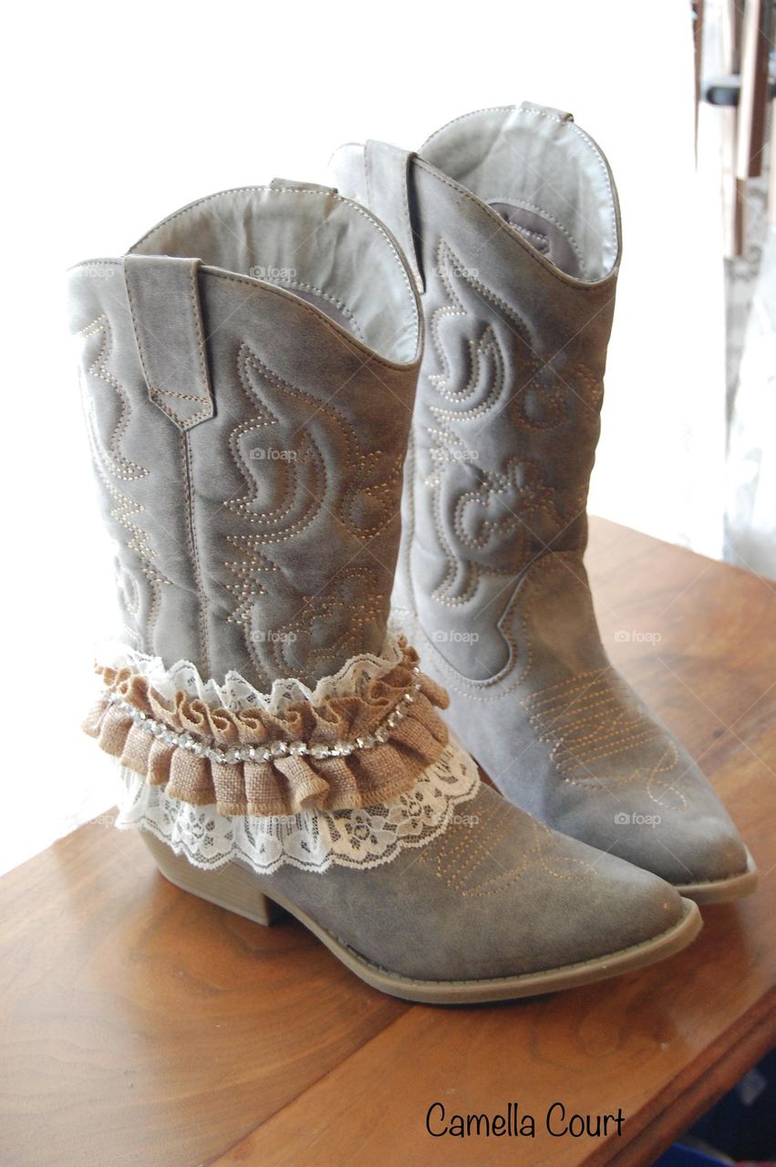 Sandy colored boots with a garter for a bride