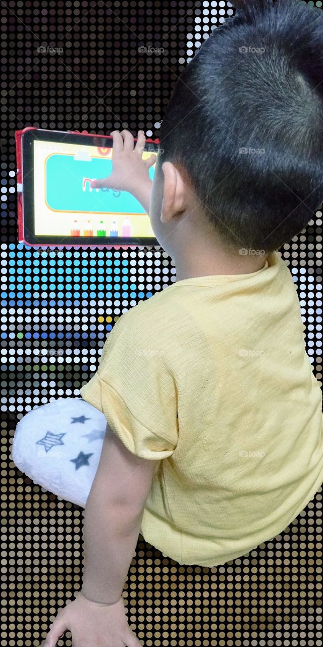 Playing with colors makes his mind relax and happy for he loves watching all the colorful things.