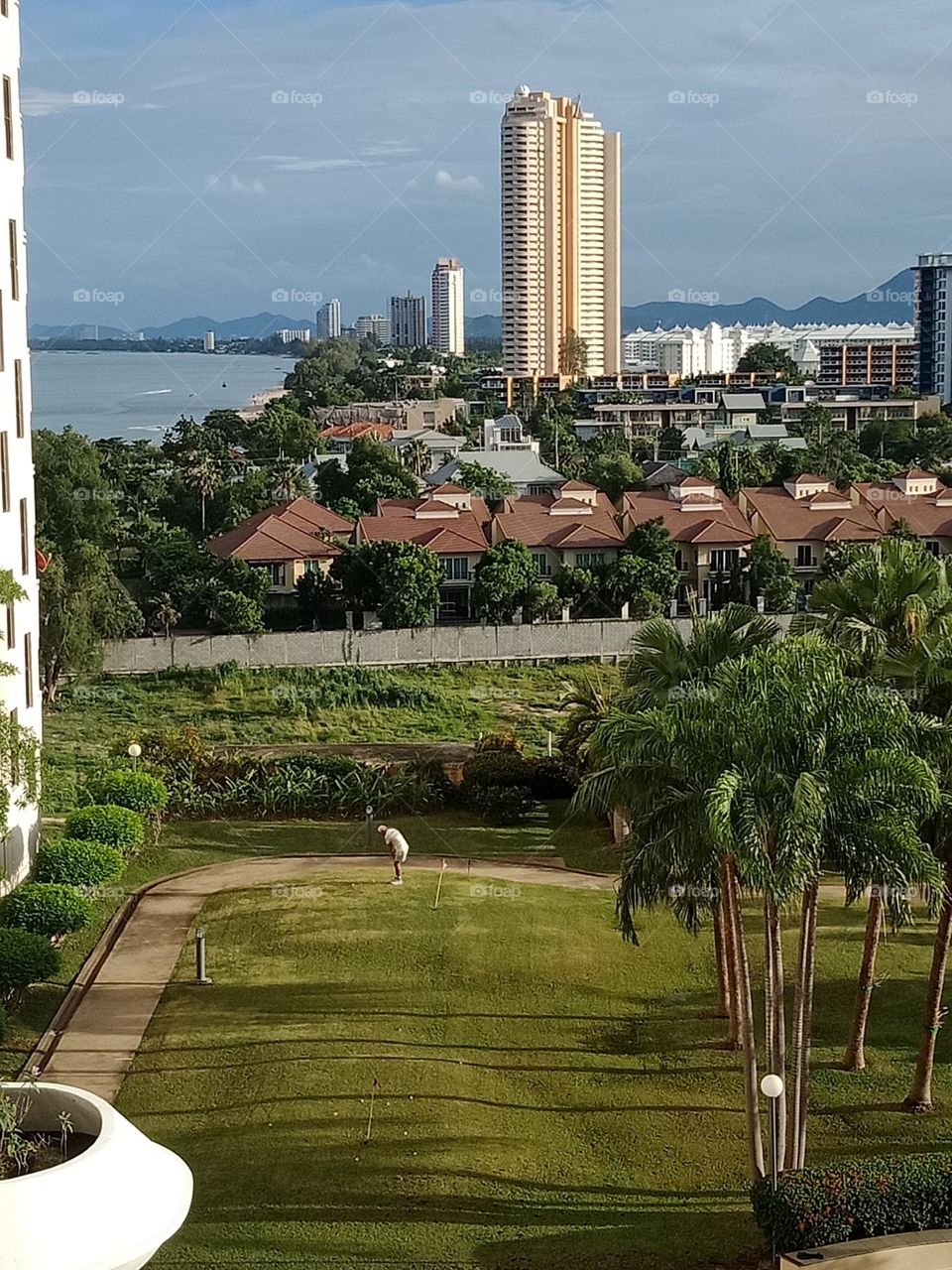 Golfing man on green