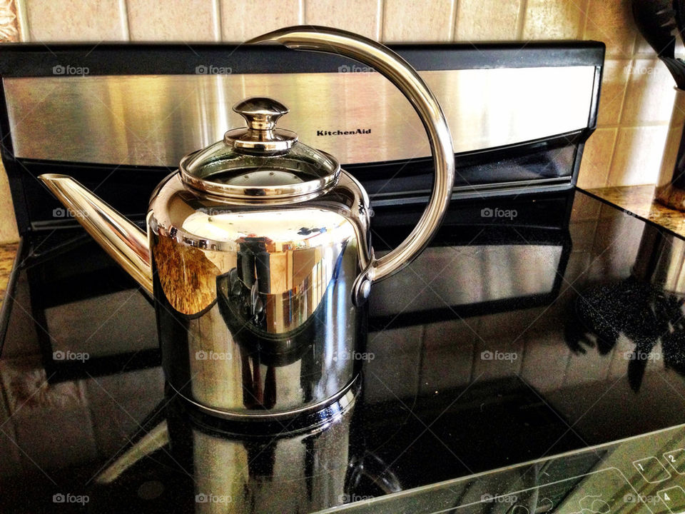 TEAPOT ON STOVE RANGE