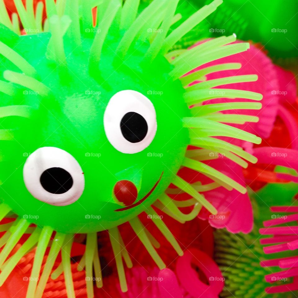 Colourful Green Cartoon Bath Toy For Kids. Soft Plastic Green Hedgehog Bath Toy With A Friendly Face