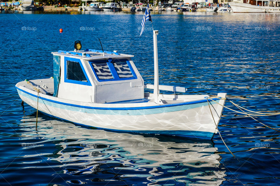 Blue and white boat in Greek harbour