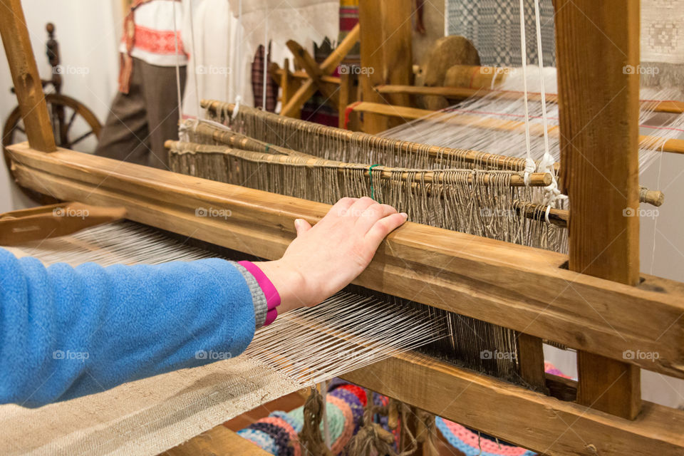 girl working on a loom