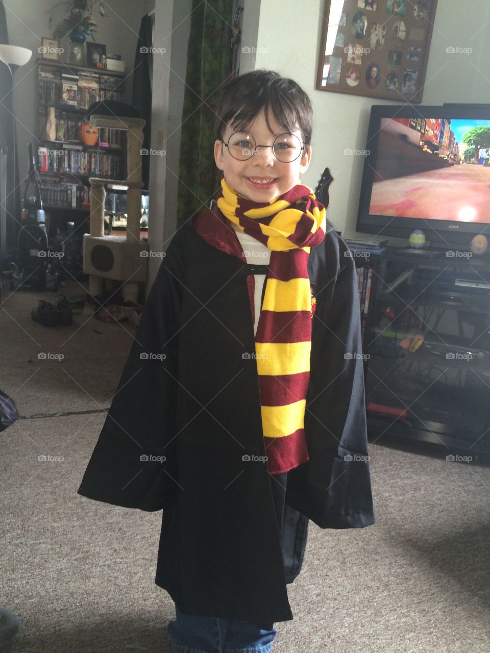 My son . My son dresses as his hero,Harry Potter. 
