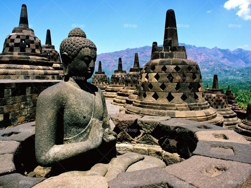 Buddha statue with stupas at Borobudur Temple