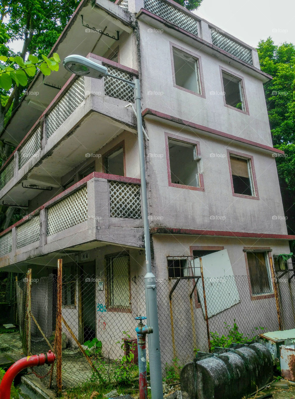 An abandoned apartment building in the evicted Ma Wan fishermen village, Hong Kong