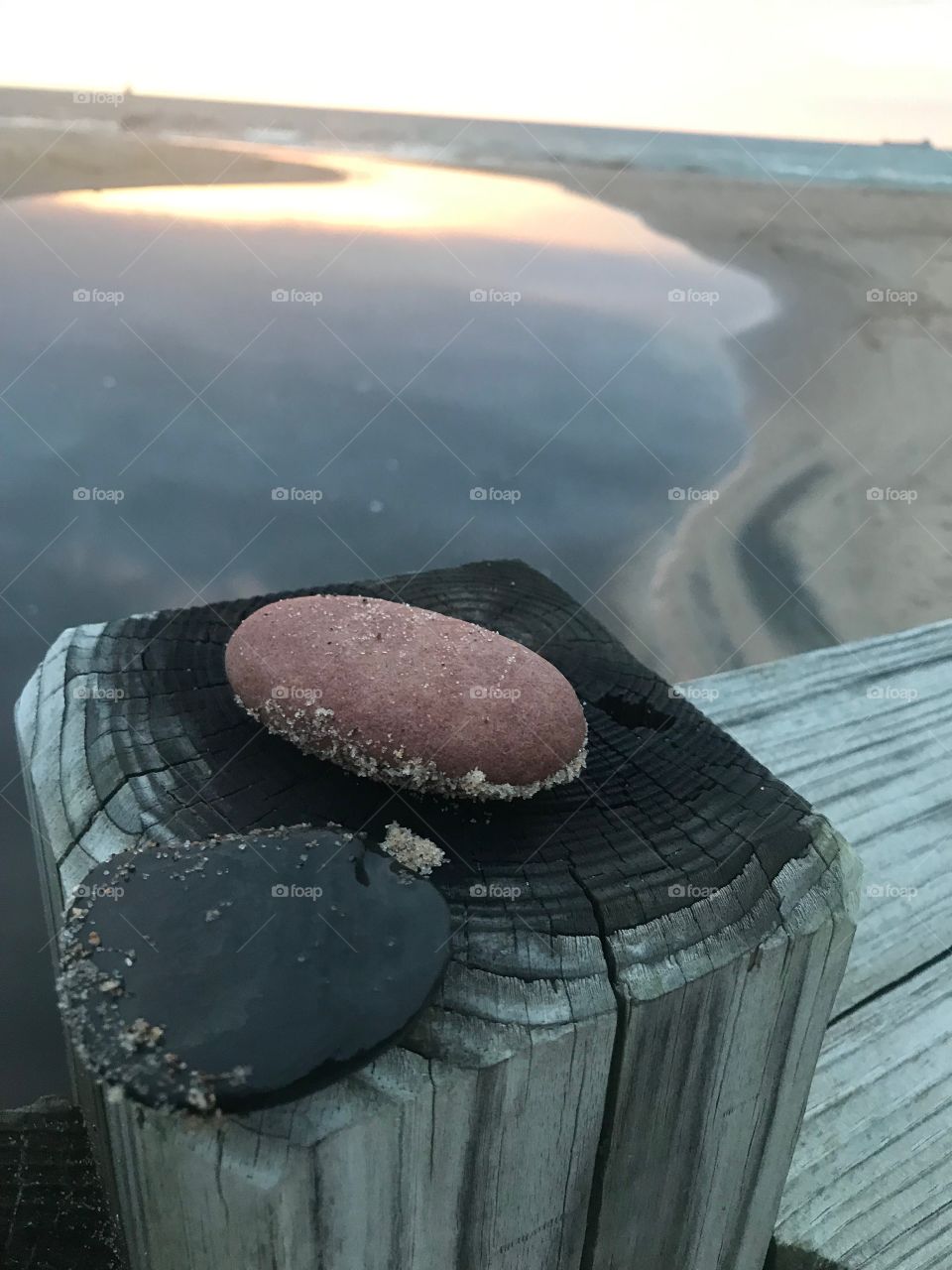 Flat Rocks on wooden post at sunset Indiana Dunes State Park 