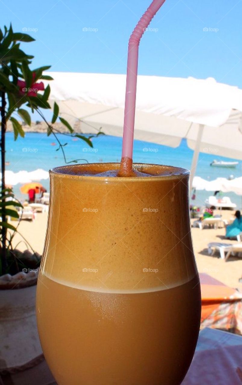 Frappe icecoffe at the beach