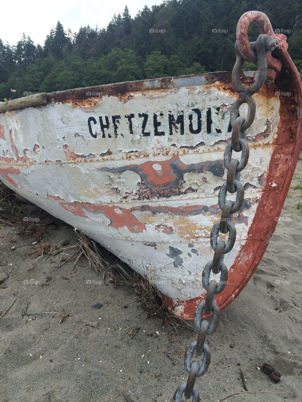A row boat beached on the shore 