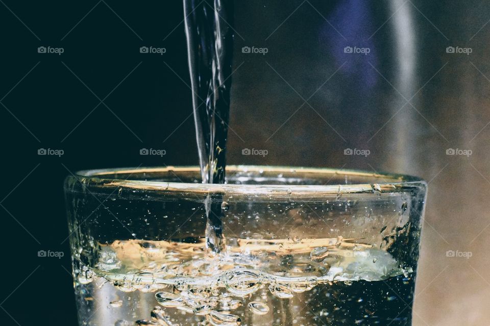 Pouring water into the glass