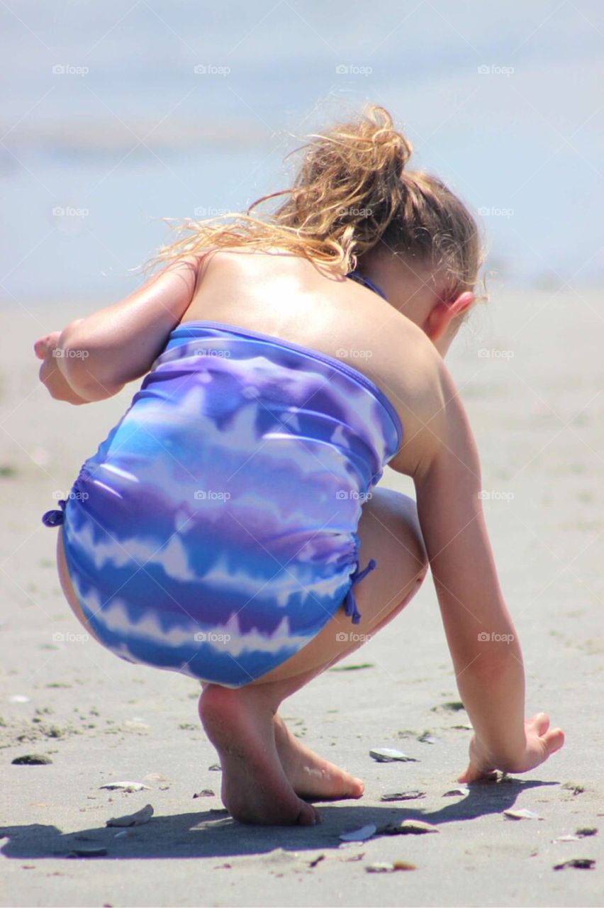 Girl playing with sand