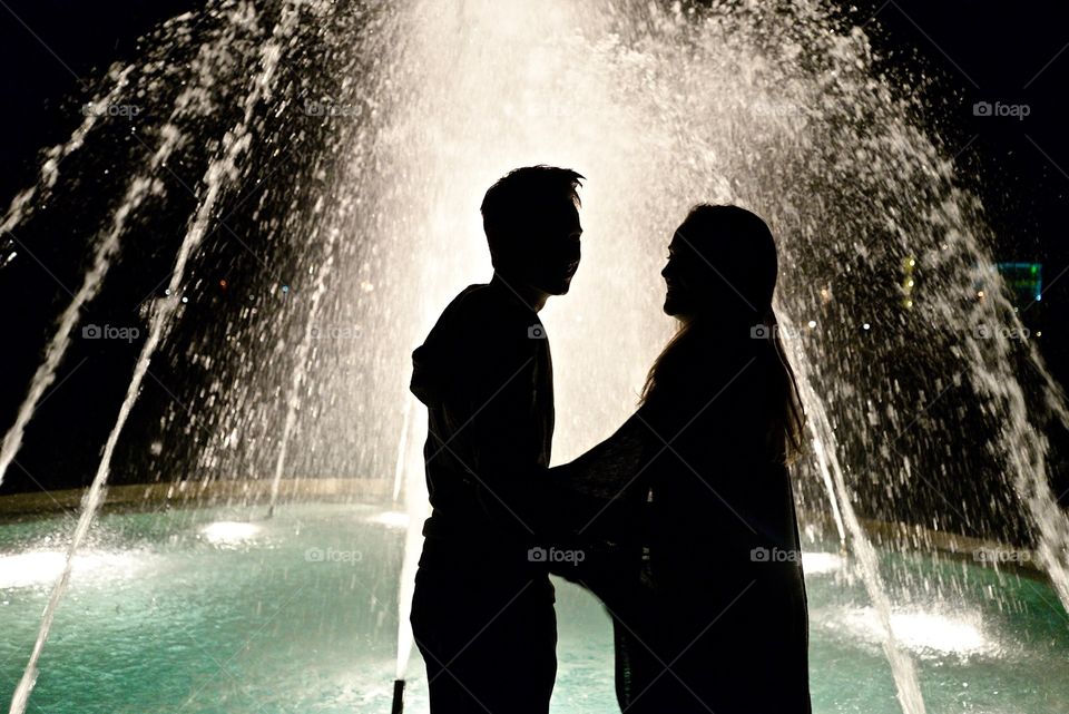 Couple together by fountain