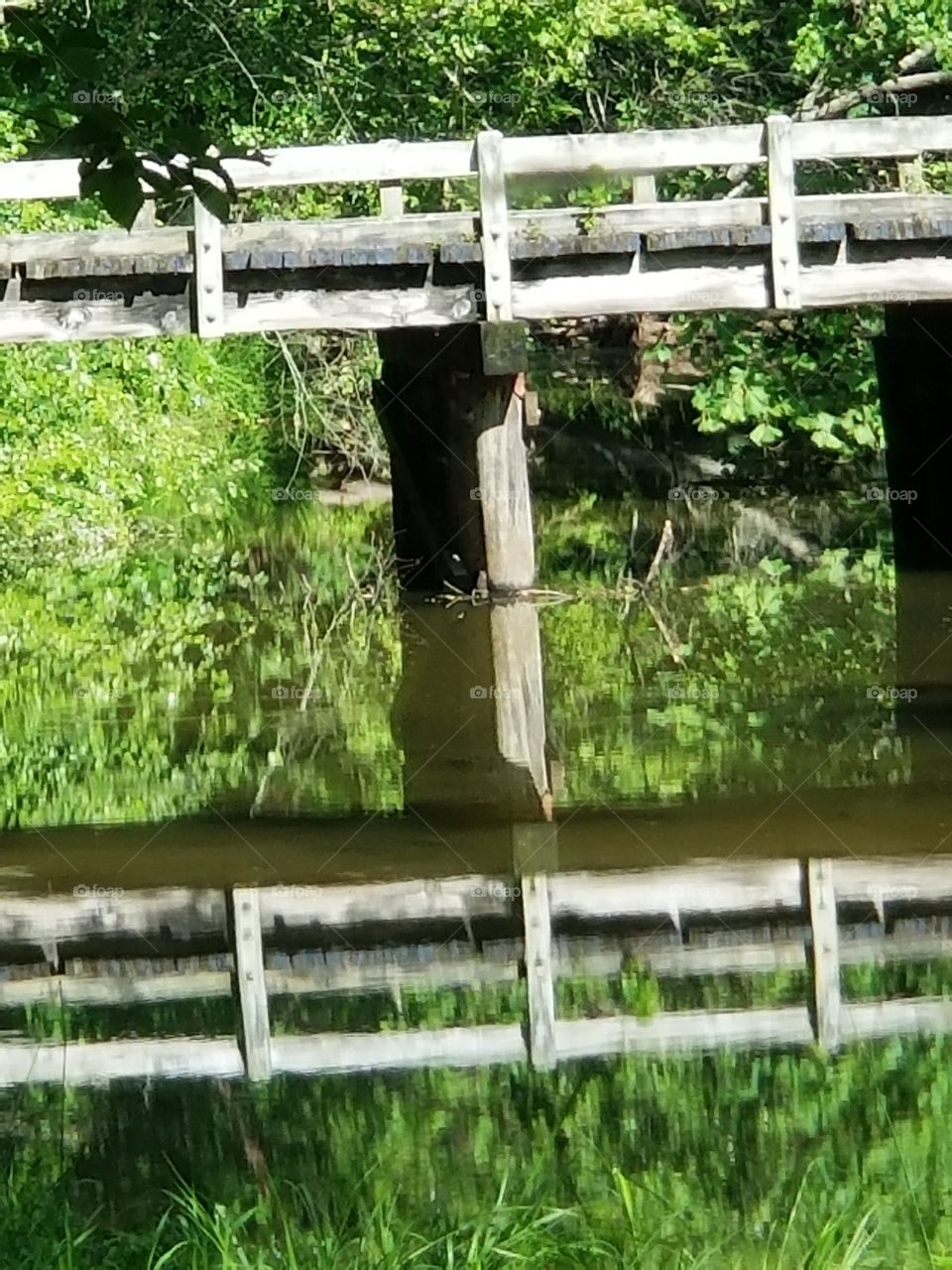 Hematite Lake highway bridge reflection