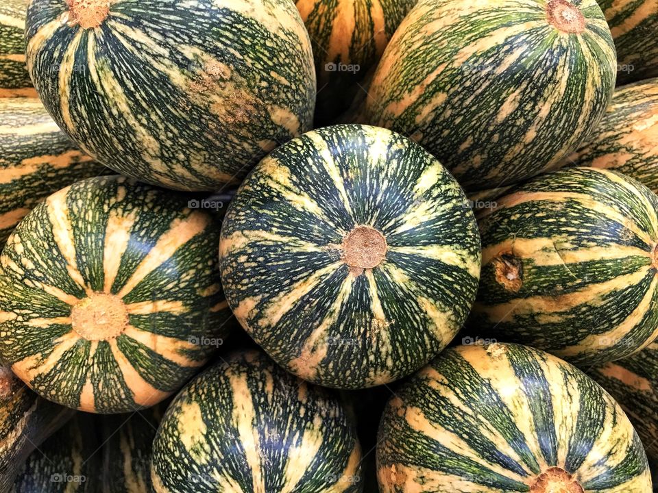 ripe pumpkins in a street market