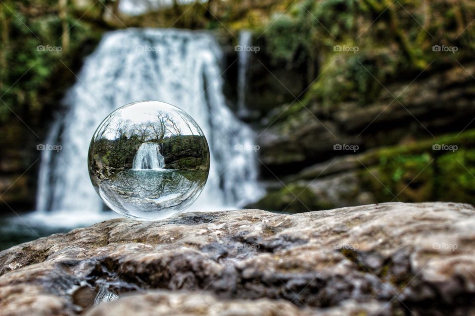 Crystal ball view of Janet’s Foss Waterfall, Yorkshire Dales National Park, UK