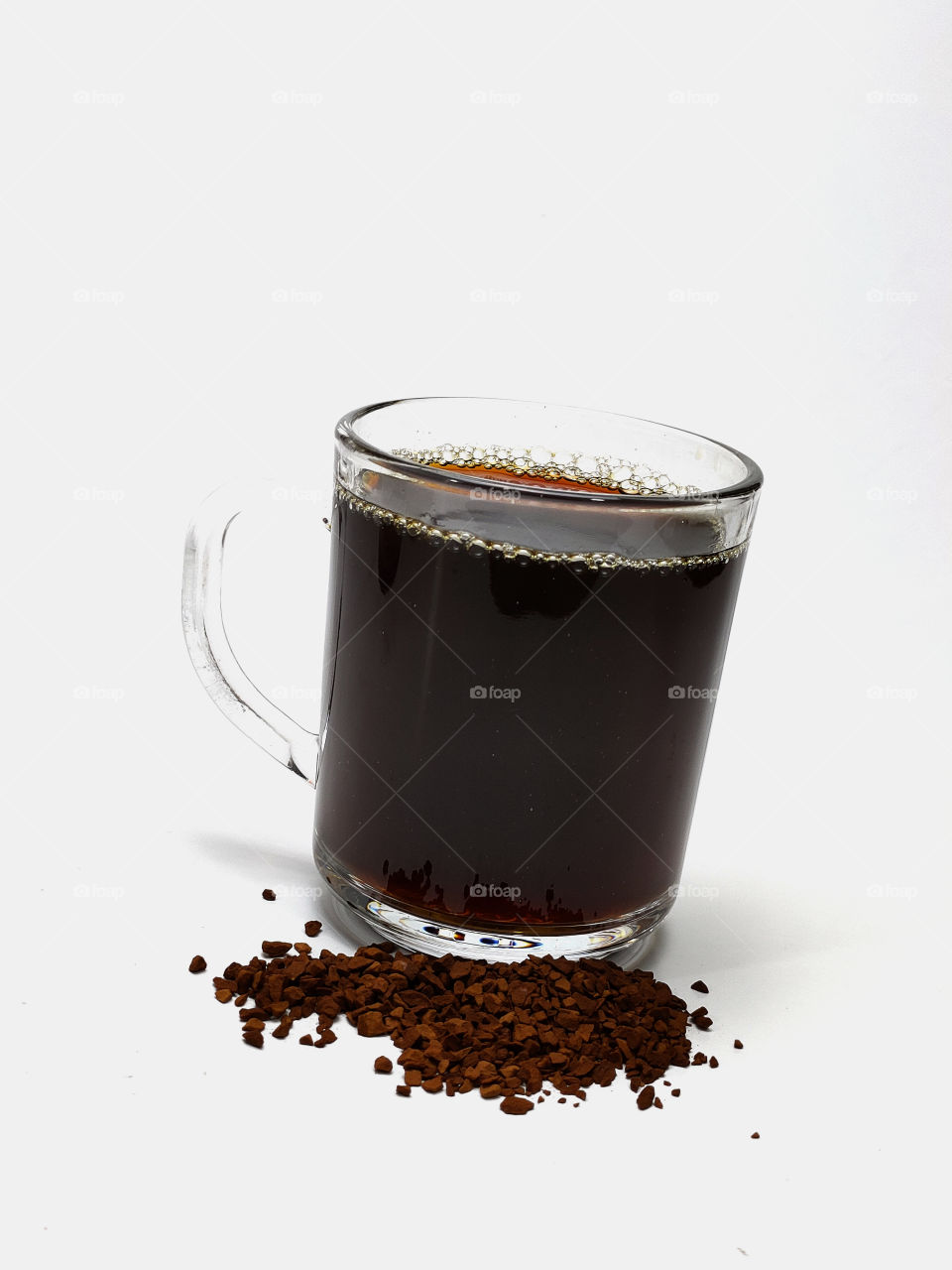 cup of coffee and coffee beans on white background