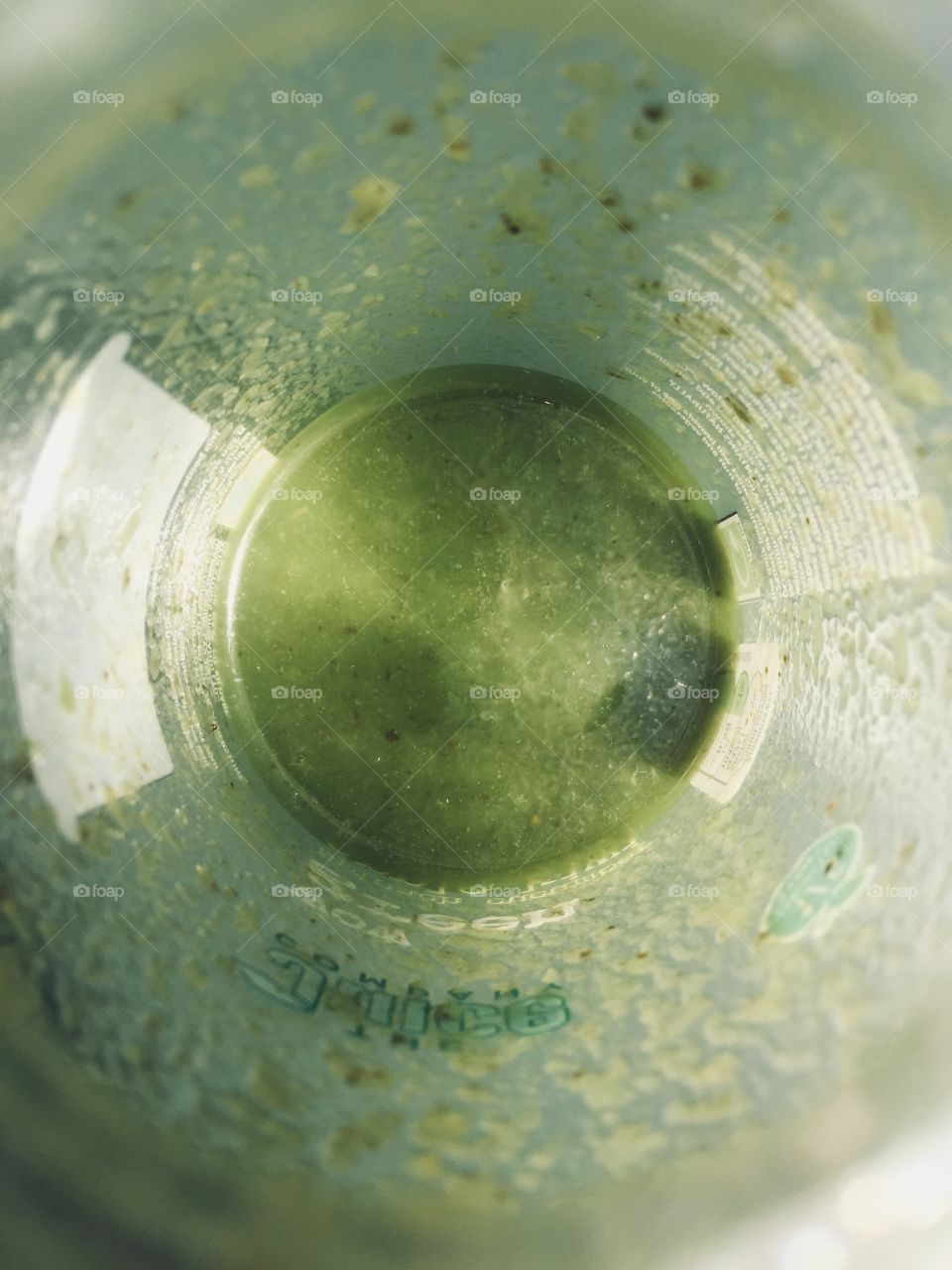 Birds eye view down the lid of a wow green smoothie