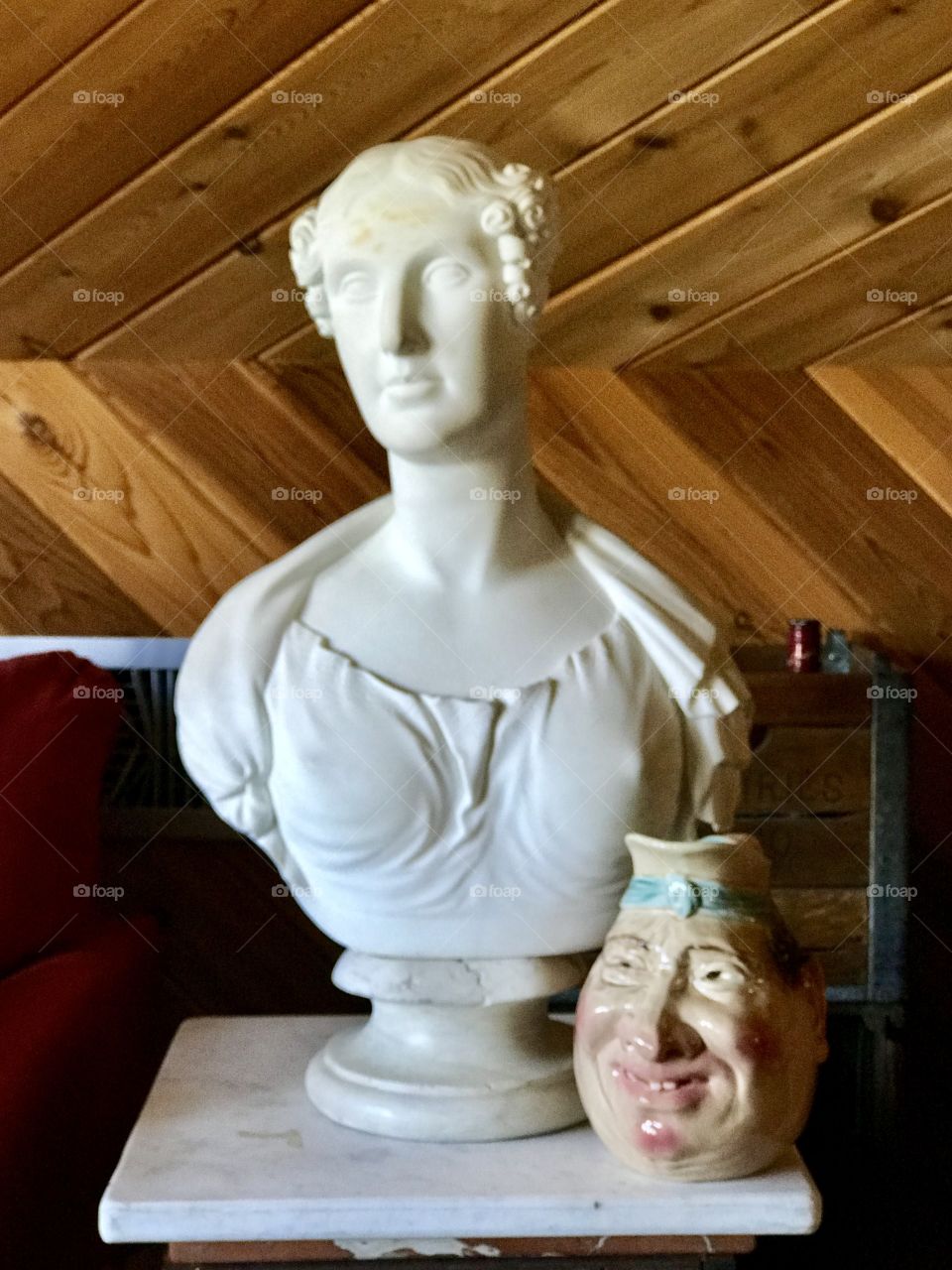 Ivory bust of a woman and a pitcher or jug with an oddity face