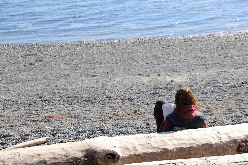 Woman reading on the beach 