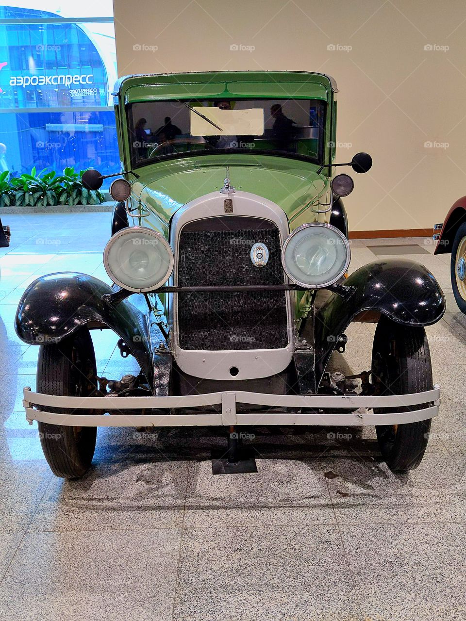 Green car.  "Willys Overland 96 A".  USA. 1929 year of release.  Front view.  Retro cars