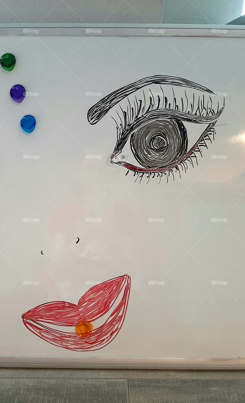 candy between lips, tear between eyelashes