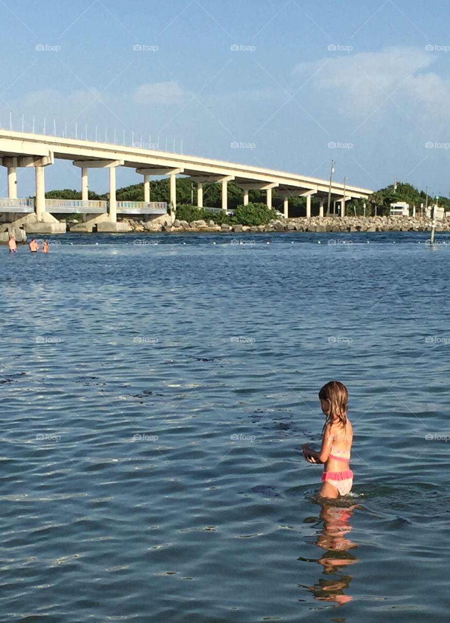 Little girl in the ocean 