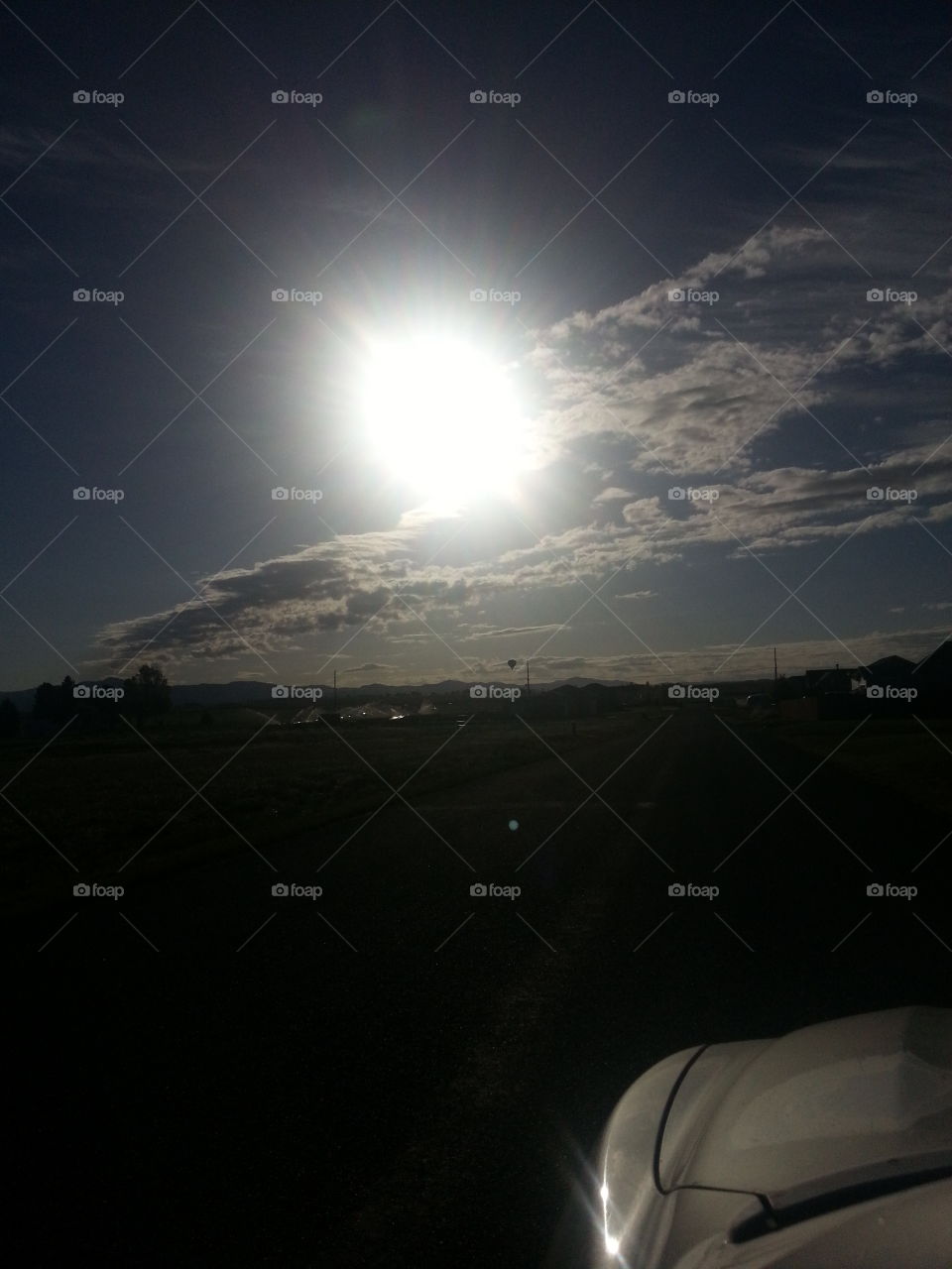 Illuminated sun in sky