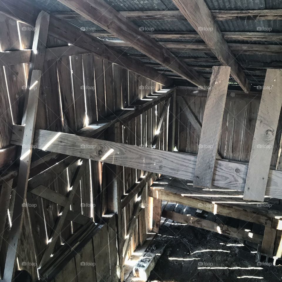 Old country barn with light streaming in.