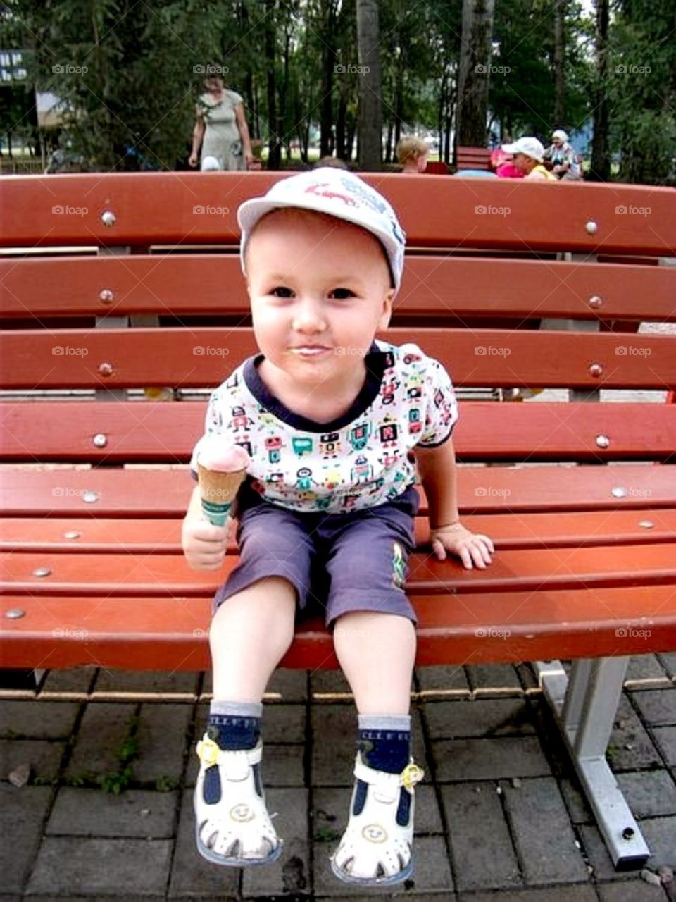 Child, boy, summer on the bench, eat ice cream, park