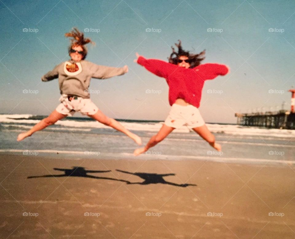 Jumping for joy on Daytona Beach, Florida, USA.