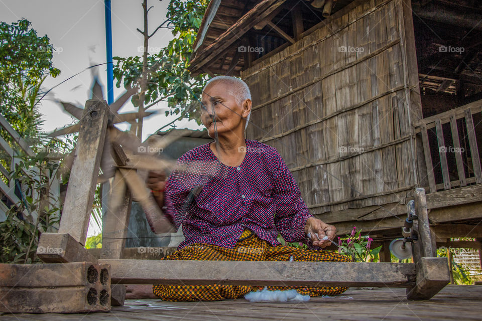 Spinning silk thread on Silk Island 