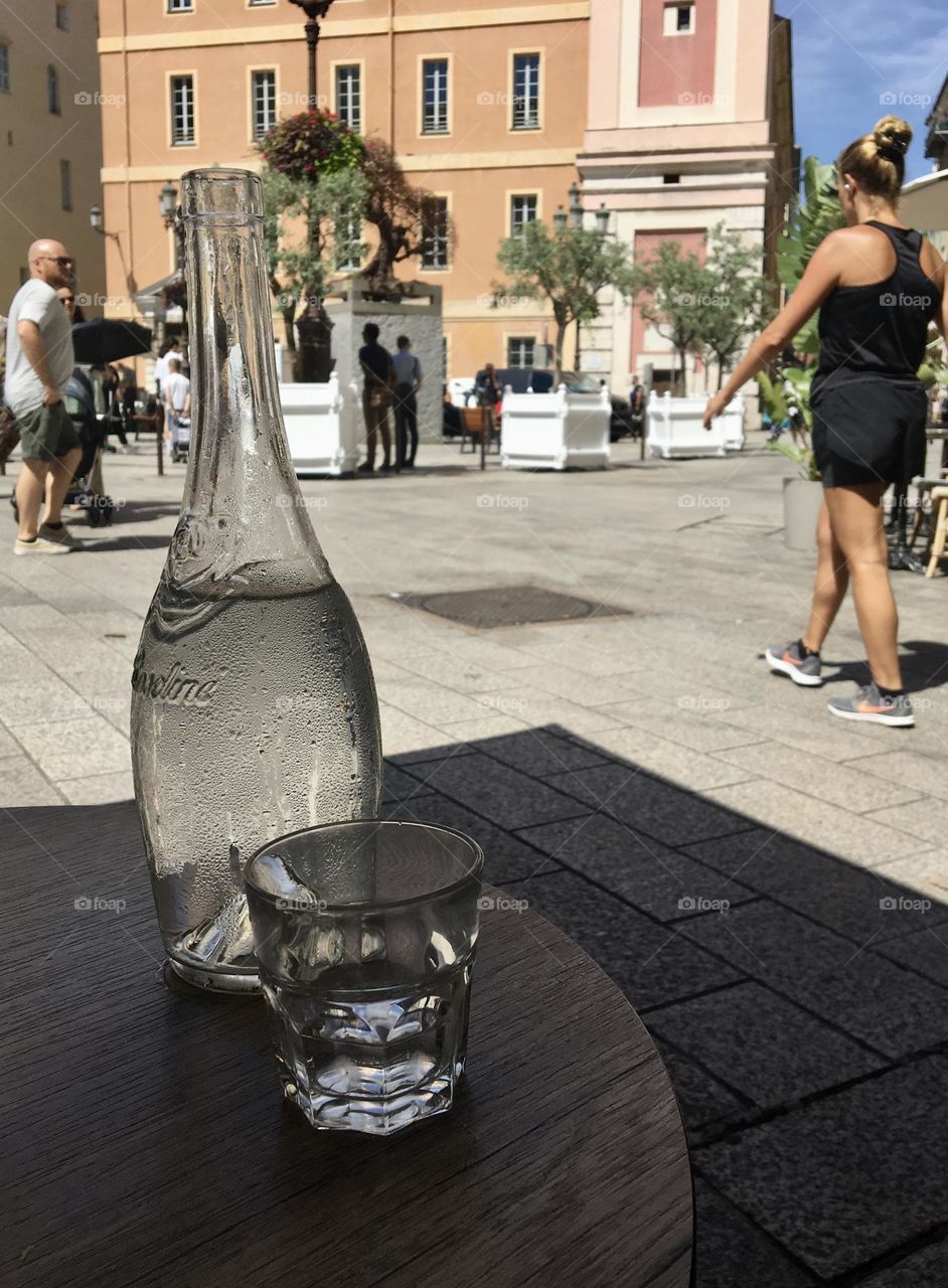It’s summertime : fresh water when sitting in shadow observing activity on a sunny plaza