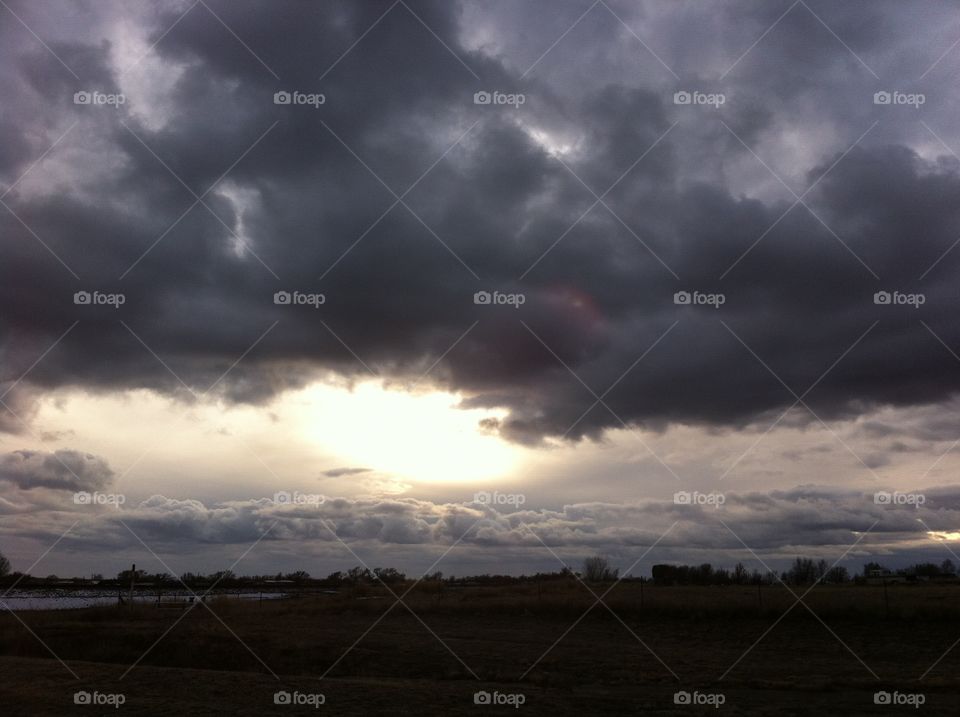 Storm clouds over open country 