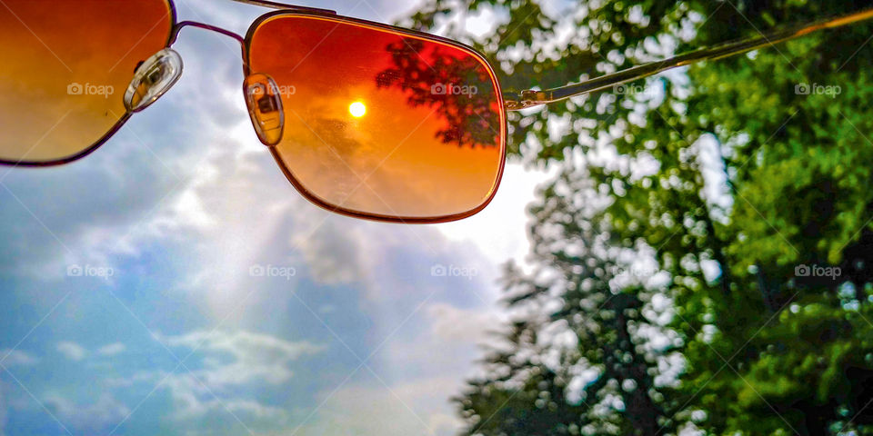 Looking at the sky and sun through rose colored sunglasses.
