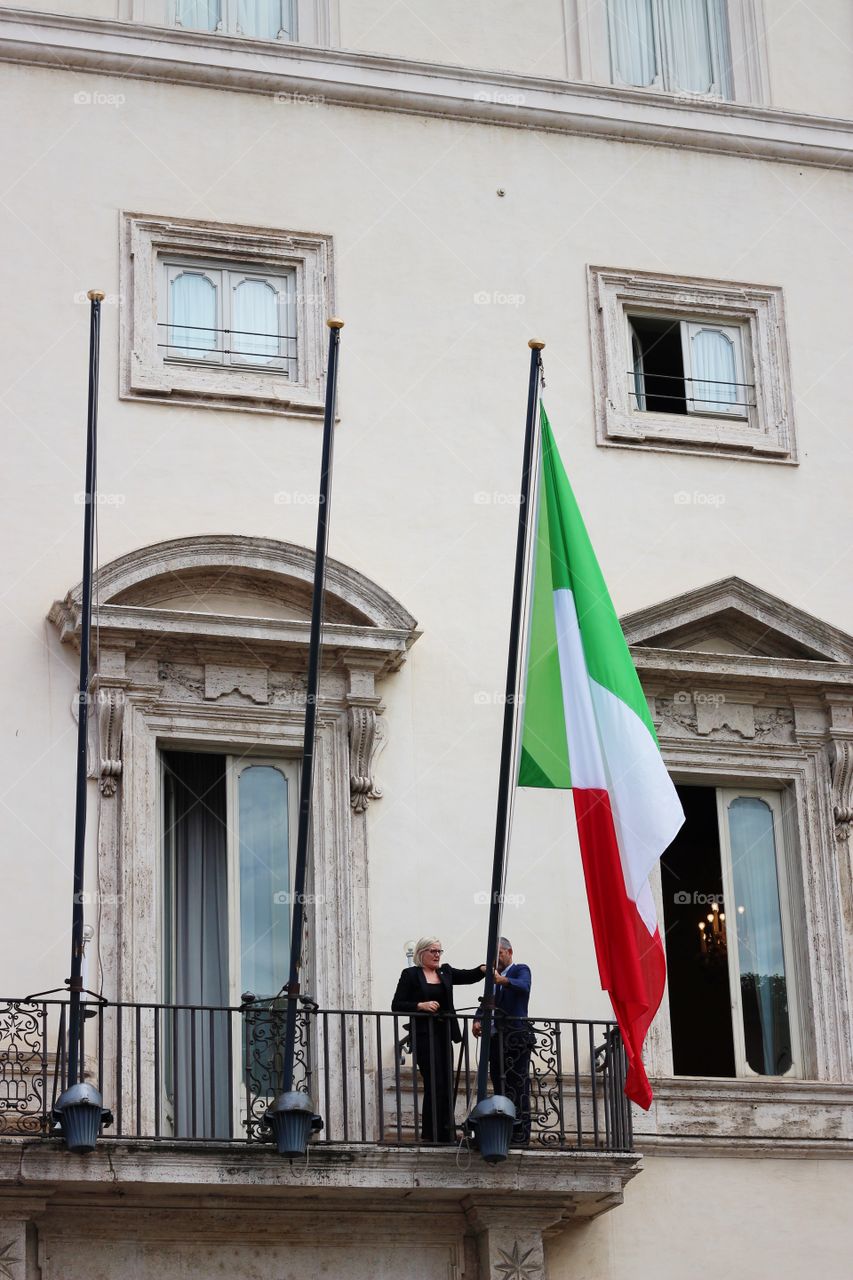 Raising the Italian flag