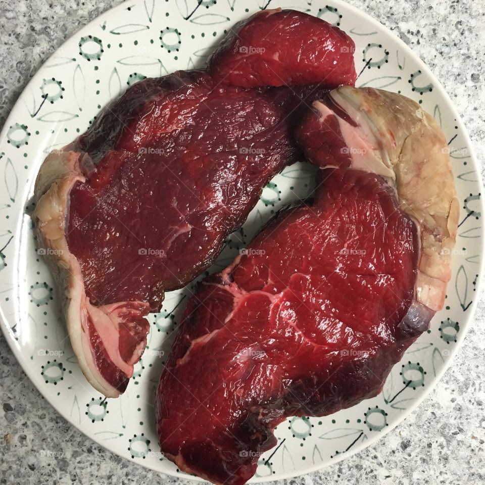 Two 8oz sirloin steaks ready to BBQ 