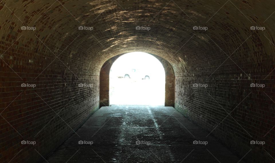 Light at the end of a red brick tunnel