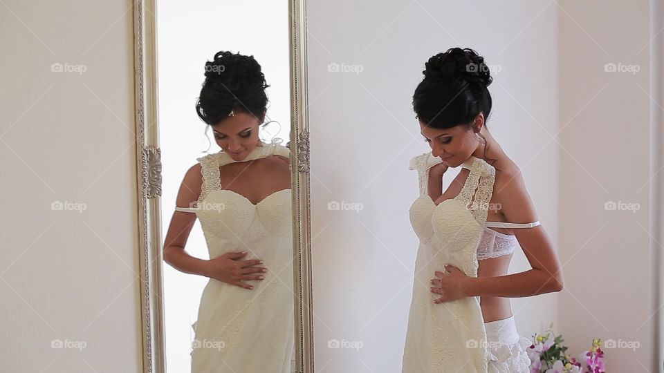 Bride near mirror 