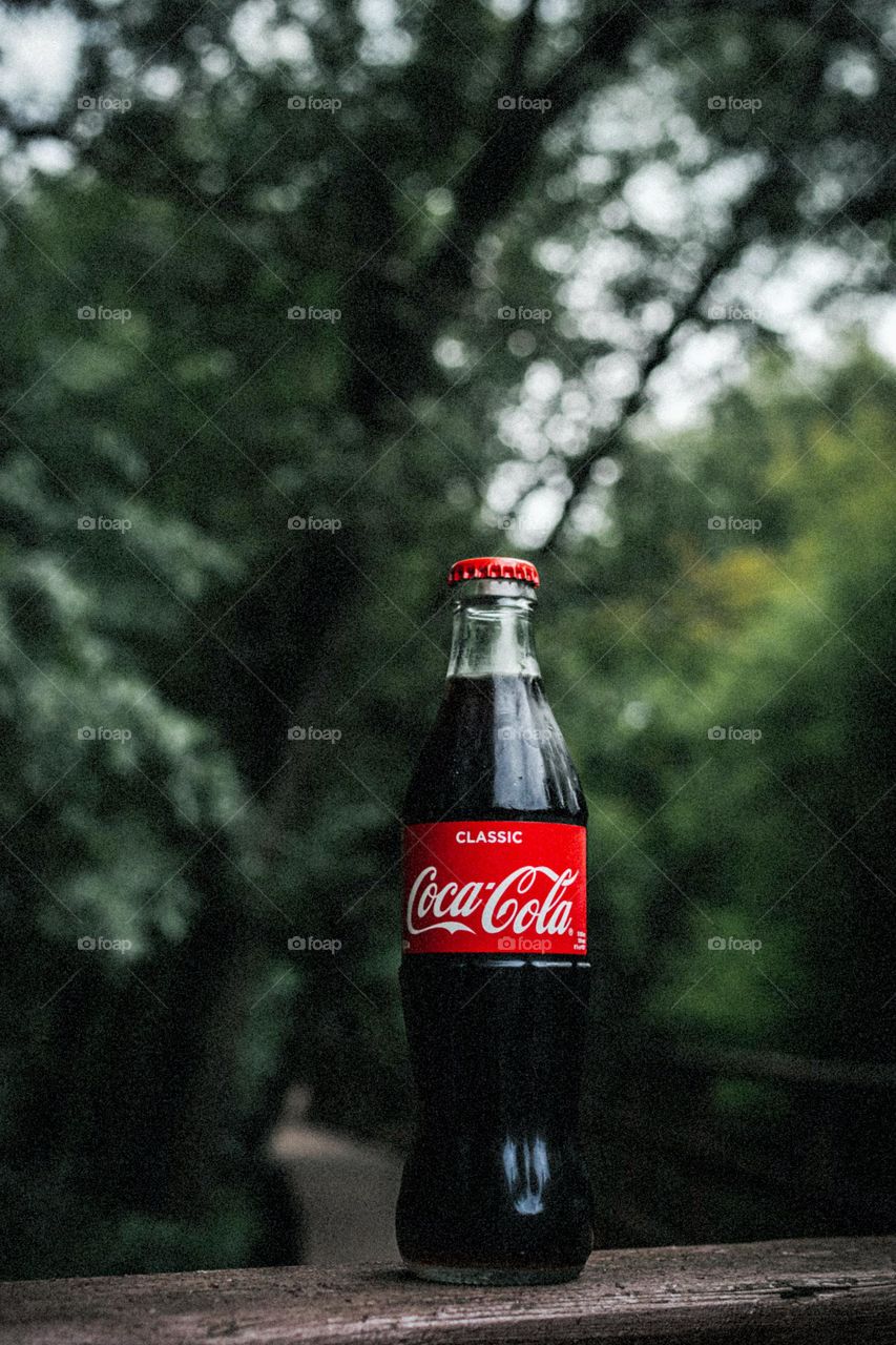 coke and a   forrest background