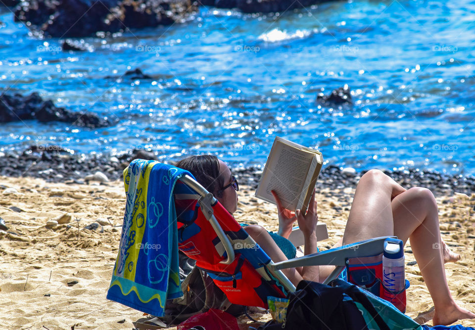 Reading a book on the beach