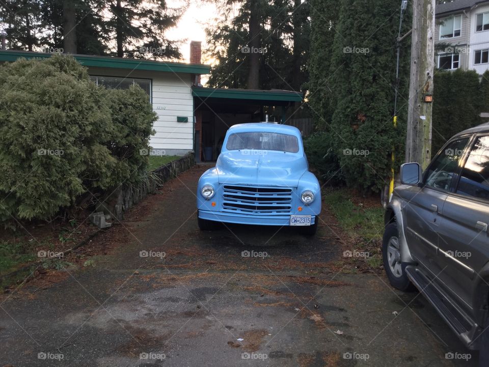 Vintage Blue Ford Truck in the Driveway 