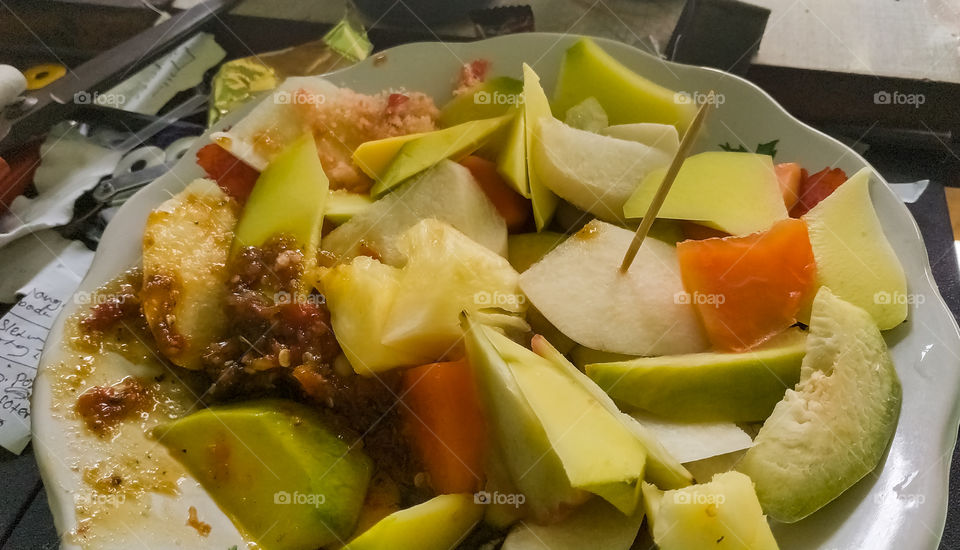 Rujak.  salad from mix fruits with coconut sugar and chili sauce