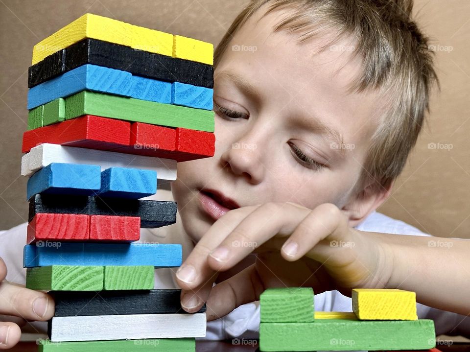 child playing jenga