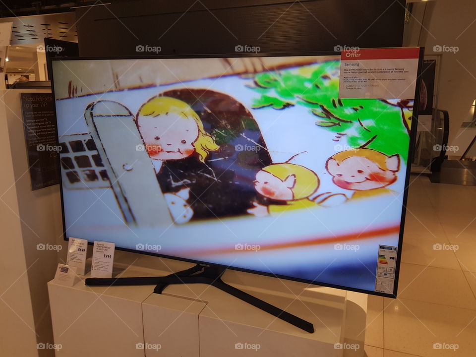Samsung 65" 4K UHD television displaying live TV at Peter Jones Sloane square Chelsea King's road London
