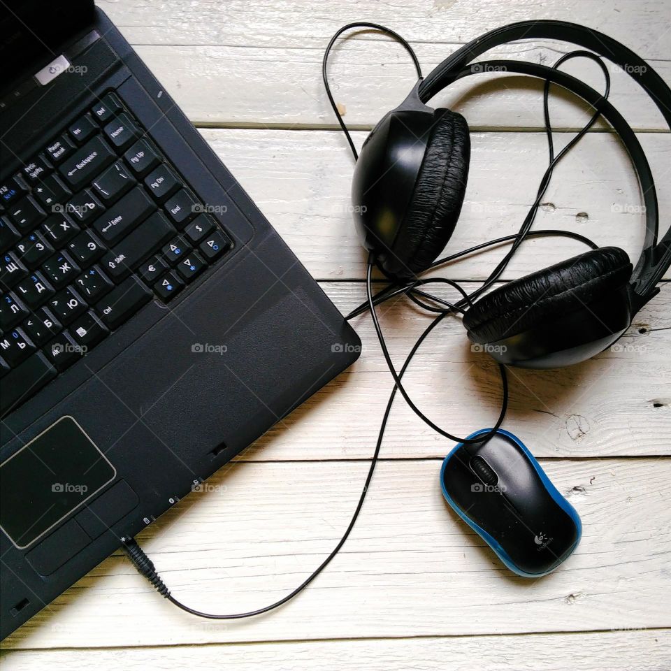 laptop, headset and computer mouse