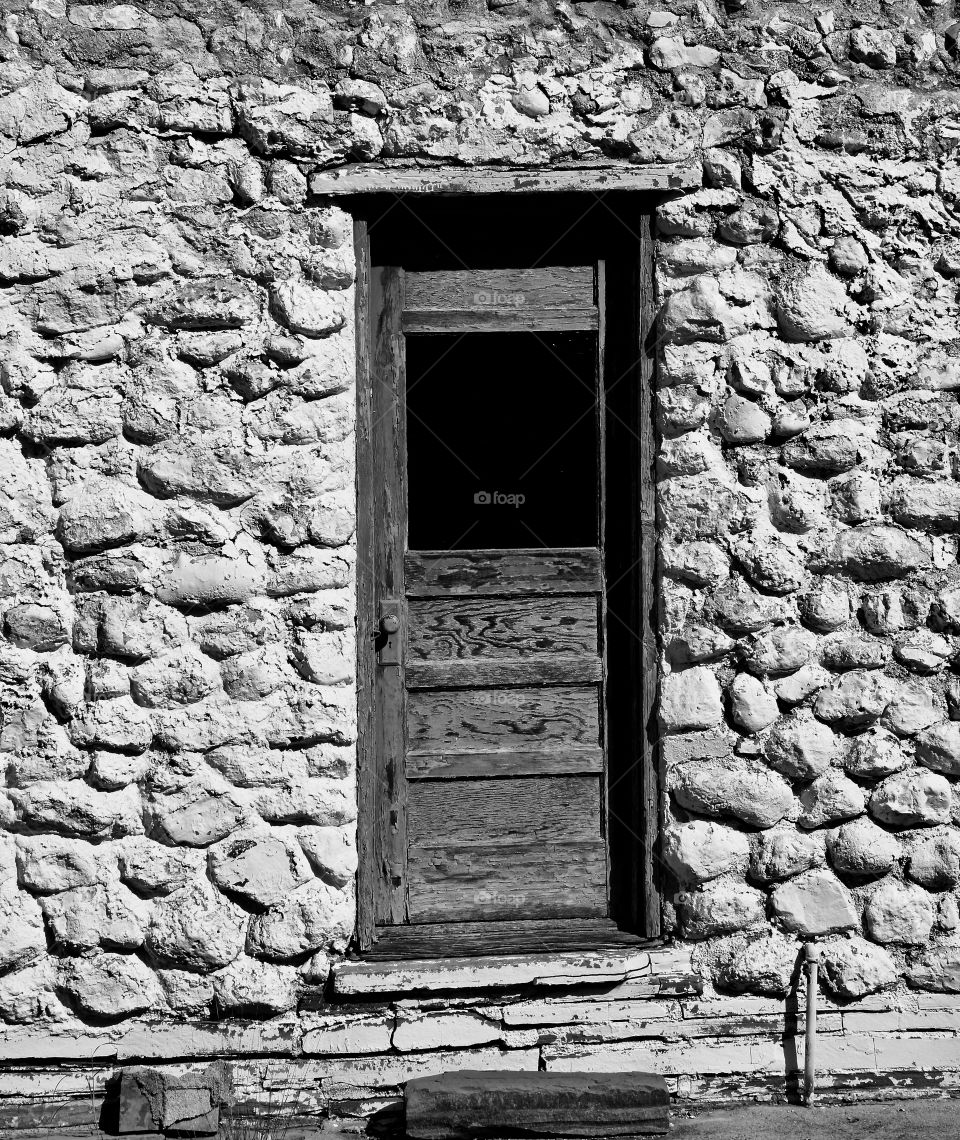 Rustic Door on White Stone Building